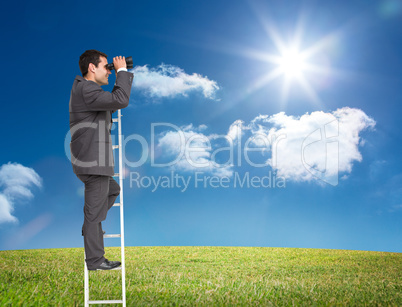 Composite image of businessman standing on ladder