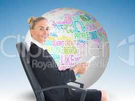 Composite image of businesswoman sitting in swivel chair holding