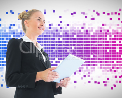 Composite image of businesswoman holding tablet