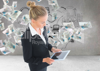 Composite image of businesswoman holding tablet