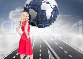 Composite image of smiling blonde standing hands on hips