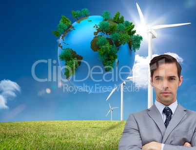 Composite image of young businessman looking at camera