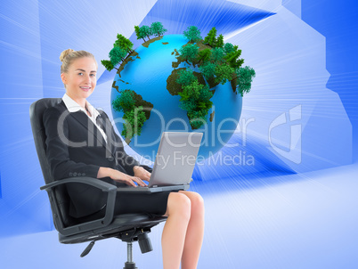 Composite image of businesswoman sitting in swivel chair with la