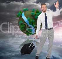 Composite image of handsome businessman with suitcase waving