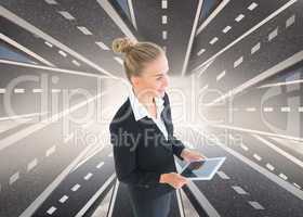 Composite image of businesswoman holding new tablet