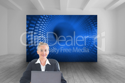 Composite image of businesswoman sitting on swivel chair with la