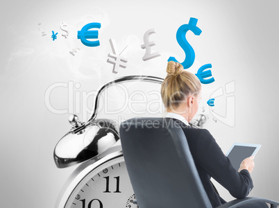 Composite image of businesswoman sitting on swivel chair with ta