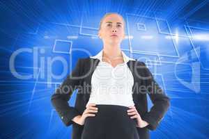 Composite image of businesswoman standing with hands on hips