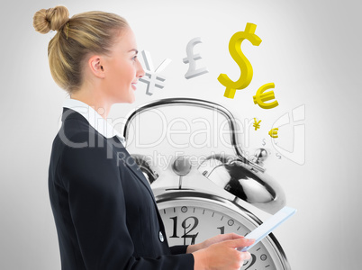 Composite image of businesswoman holding tablet