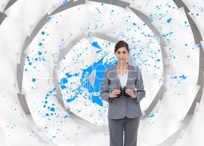 Composite image of young businesswoman with binoculars