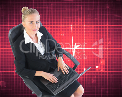 Composite image of businesswoman sitting on swivel chair with la