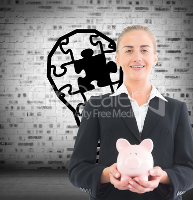 Composite image of businesswoman holding piggy bank