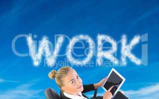 Composite image of businesswoman sitting on swivel chair with ta