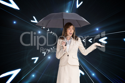 Composite image of elegant businesswoman holding black umbrella