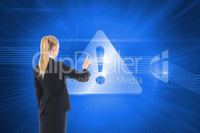 Composite image of businesswoman pointing somewhere