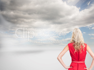 Composite image of elegant blonde standing hands on hips