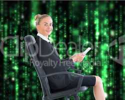 Composite image of businesswoman sitting in swivel chair holding
