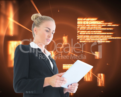 Composite image of businesswoman holding tablet