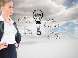 Composite image of businesswoman standing with hands on hips