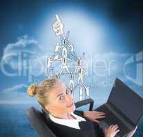 Composite image of businesswoman sitting on swivel chair with la