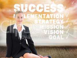 Composite image of businesswoman using laptop