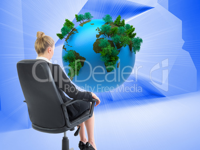 Composite image of businesswoman sitting on swivel chair in blac