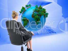 Composite image of businesswoman sitting on swivel chair in blac