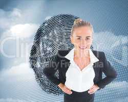 Composite image of businesswoman standing with hands on hips