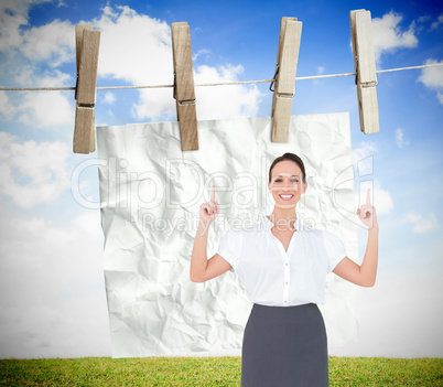 Composite image of smiling gorgeous businesswoman posing