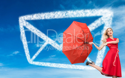 Composite image of elegant blonde holding umbrella