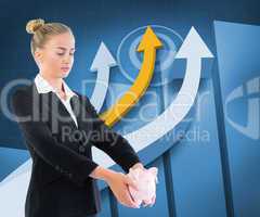 Composite image of businesswoman holding piggy bank