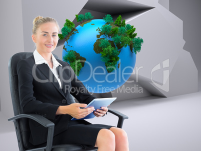 Composite image of businesswoman sitting on swivel chair with ta