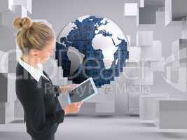 Composite image of businesswoman holding new tablet