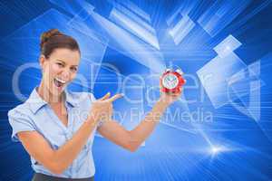 Composite image of businesswoman indicating alarm clock