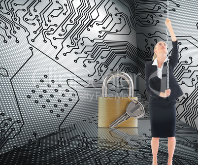 Composite image of businesswoman pulling a chain