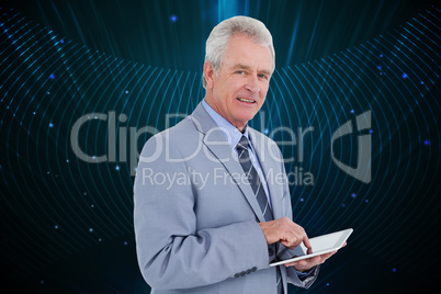 Composite image of side view of mature tradesman with tablet com