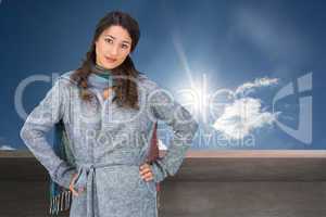 Composite image of serious pretty brunette wearing winter clothe