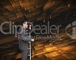 Composite image of businessman standing on ladder