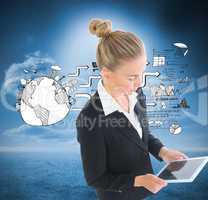 Composite image of businesswoman holding new tablet