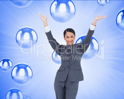 Composite image of cheering businesswoman