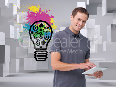 Composite image of smiling young man with tablet computer