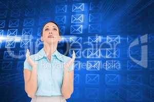 Composite image of concerned young businesswoman praying