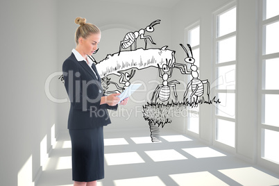 Composite image of businesswoman holding new tablet