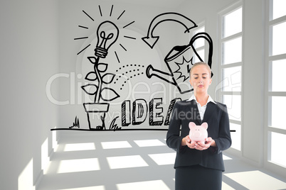 Composite image of businesswoman holding pink piggy bank