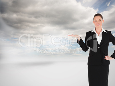 Composite image of charming woman in suit showing a copy space