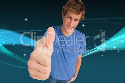 Composite image of fisheye view of a male student the thumb-up