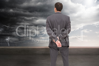 Composite image of rear view of classy businessman posing