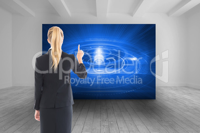 Composite image of businesswoman pointing somewhere