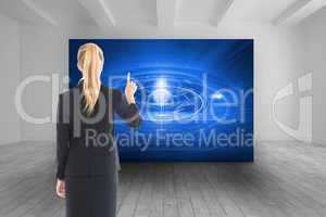 Composite image of businesswoman pointing somewhere