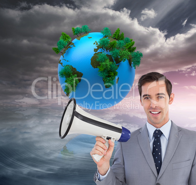 Composite image of smiling businessman holding a megaphone